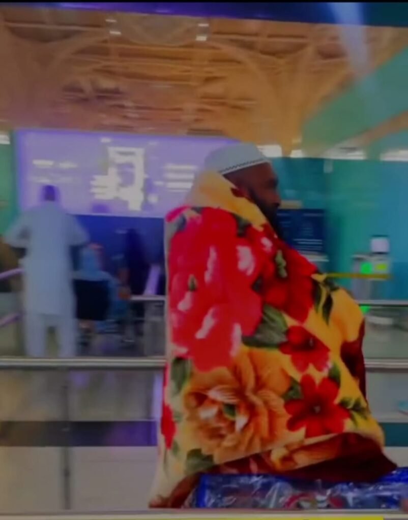 Man Wears Blanket at Airport to Avoid Luggage Overweight Charges
